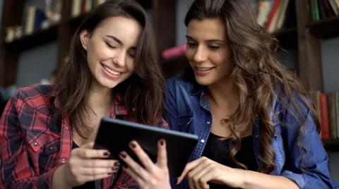 Two female friends with tablet computer Stock Footage 69025150