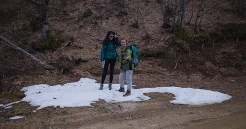 Two Female Friends Take a Break From Their Mountain Hike to Enjoy the Scenic Stock Footage 343014618