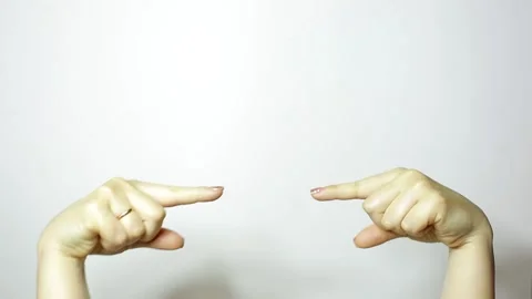 Two female hands pointing index fingers in the middle, pay attention Vídeo Stock 208810000