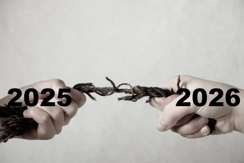 Two female hands pull a rope in opposite directions with the numbers 2025 and Stock Photos
