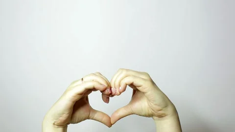 Two female hands put their palms in the heart, a sign of love Vídeo Stock 208810040