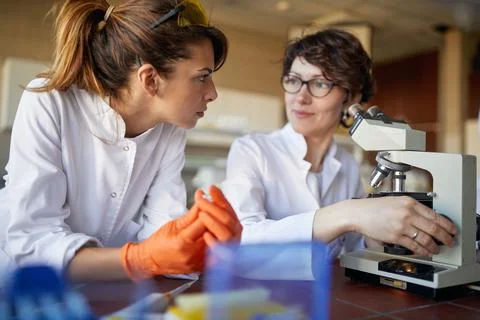 Two female laborant practitioners analyzing samples Stock Photos