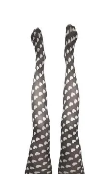Two female legs in heart pattern tights isolated white background. Pair of 库存照片