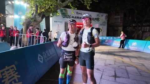 Two Female Runners Posing with Thumbs Up at Start Barriers, Lushan Stock-Footage 346701715