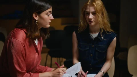 Two Female Students Reading Script in Theater Acting Workshop Stock Footage 344521718