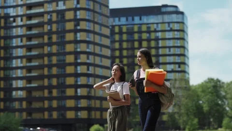 Two female students walking after classes Stock Footage 112321528