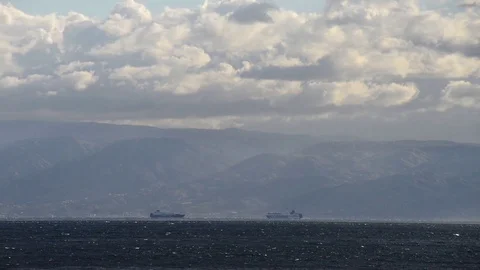 Two ferries cross the Strait of Messina with strong current on the sea Stock Footage 83886278