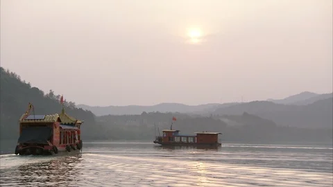 Two ferries sailing in the sea at sunset in Sichuan province, China Stock Footage 87760984