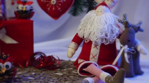 Two Festive Photo Frames Are Laid Out Among Hand Made Toys Fot Kids Under a Stock Footage 72875974