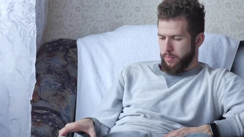 Two fiends are sitting and have lively conversation, Young man drinking coffee Video stock 72551674