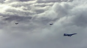 Two fighter planes fly over bomber Stock Footage 85603513