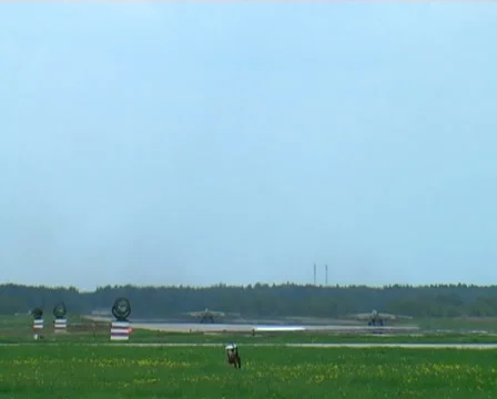 Two fighter take wing from air base Stock Footage 1006610