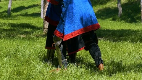 Two fighters in plate armor are engaged in hand-to-hand fighting Stock-Footage 122079880
