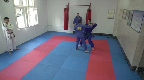 Two fighters show aikido techniques for self defense by Pakito,slow motion,crane Stock Footage 63153340