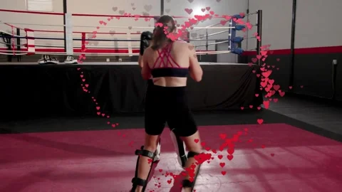 Two fighters stepping in, martial arts sparring, red heart particles arcing into Stock Footage 334316463