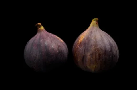 Two figs isolated on black background Stock Photos