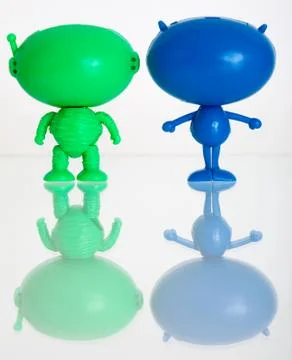 Two figures of aliens on a white Stock Photos