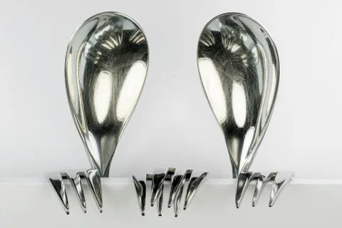 Two figures made of spoons and forks. Stock Photos