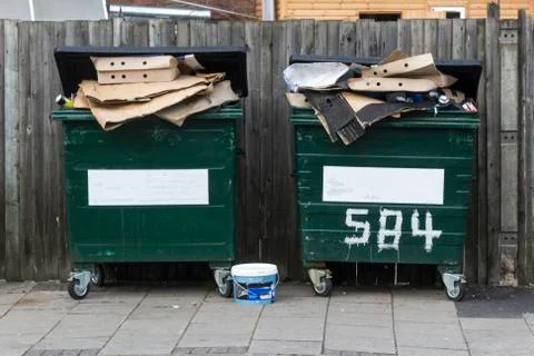 Two filled dumpsters 写真素材
