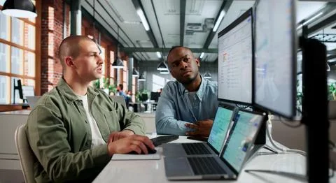 Two Financial Analysts Collaborate Using Cloud Software For Accurate Cashflow Stock Photos