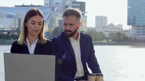 Two financial experts examining calculations of new project Video stock 120666038
