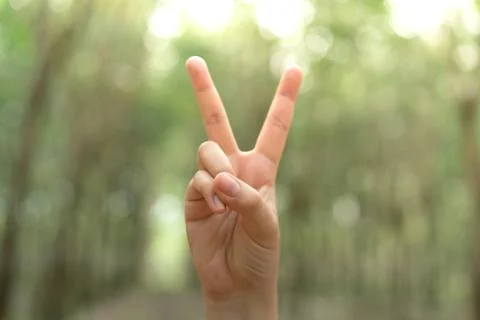 Two fingers with blur background body language sign V sign. Stock Photos