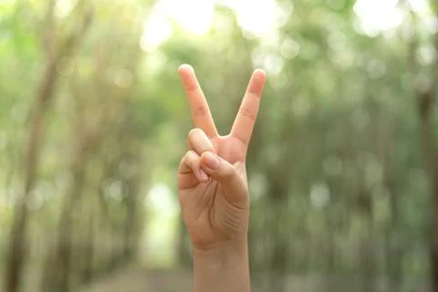 Two fingers with blur background body language sign V sign. Stock Photos