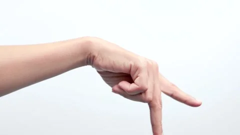 Two fingers like walking on the floor isolated on white background Stock Footage 244698416