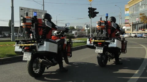 Two firefighter bikes are starting at the traffic lights Stock Footage 63206948