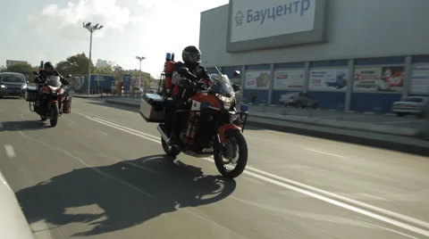 Two firefighter motorcycles overtake the camera Stock Footage 63207035