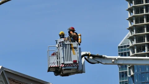 Two firefighters in capsule of ladder Stock Footage 116078665