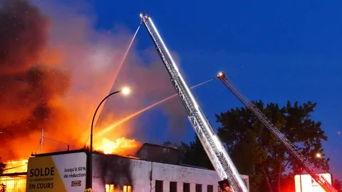 Two firefighters ladder battling flames Stock Footage 115967716