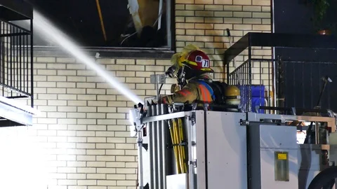 Two firefighters with water jets Stock Footage 114752148