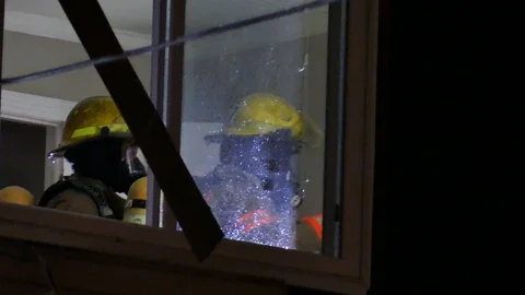 Two fireman inside house Stock Footage 125415902