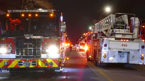 Two firetrucks parked in the street Stock Footage 139664425