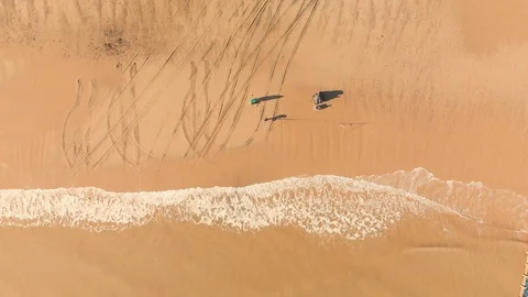Two Fishermen on the beach casting off Stock Footage 97046609