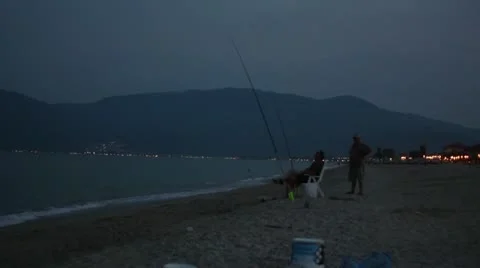 Two fishermen on the beach Stock Footage 11890787