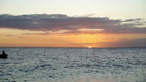 Two fishermen rowing at sunset Video stock 167950734