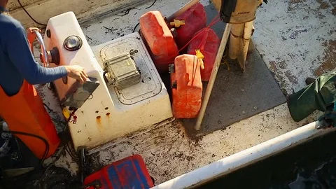 Two fishers heading out on their boat. 스톡 동영상 88372432