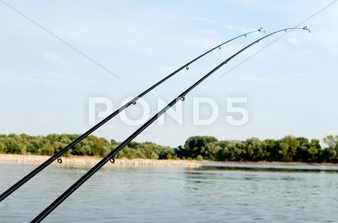 Two fishing rods Stock Photos