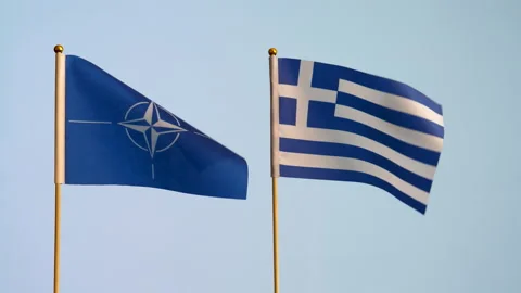Two flags NATO and Greece national waving against white background Vídeos de archivo 244530409