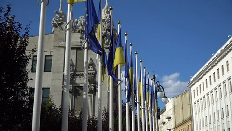 Two flags of Ukraine and the European Union are fluttering in the wind on the Stock Footage