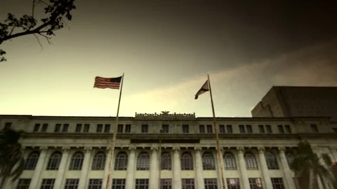 Two Flags in Wind Outside of Large Courthouse HD Video Stock Footage 89811667