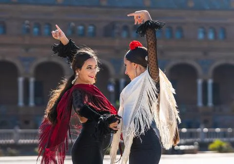 Two flamenco dancers performing face to face outdoors Stock Photos