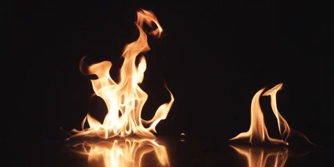 Two flames on black surface Stock Footage 102127393