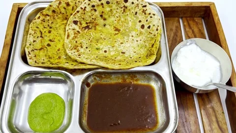 Two flat bread served along flavorful dips Stock Footage 302070554