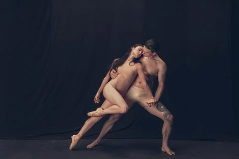 Two flexible dancer, young man and woman in modern art performance isolated on Stock Photos