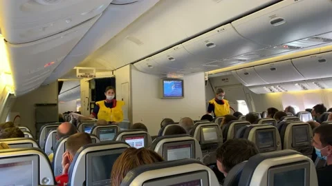 Two flight attendants explain how to use a life jacket Video stock 139745488