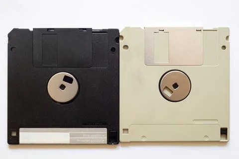 Two floppy disks side by side, one has an apple sticker Stock Photos