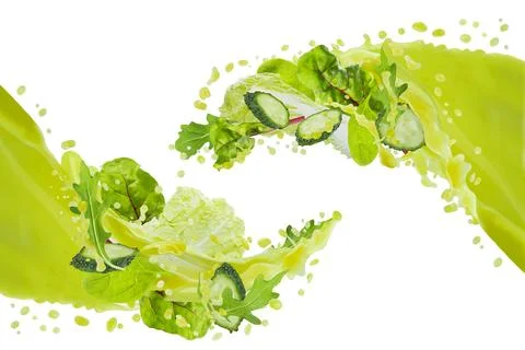Two flows of green vegetable juice pouring and connect in air with flying gre Stock Photos